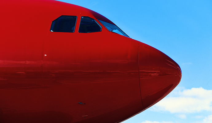 red-airplane-side-sky-background