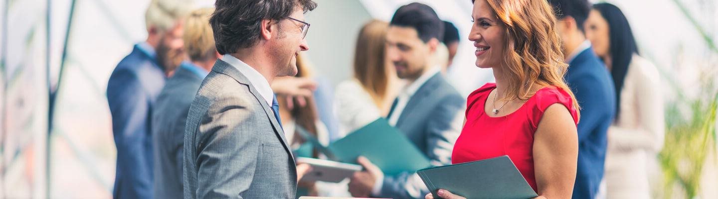 Networking in an office setting, holding-folders.