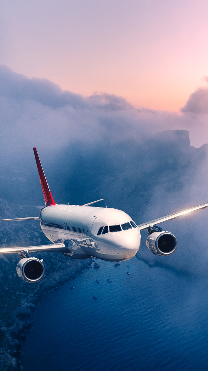 passenger-airplane-is-flying-clouds-sunset