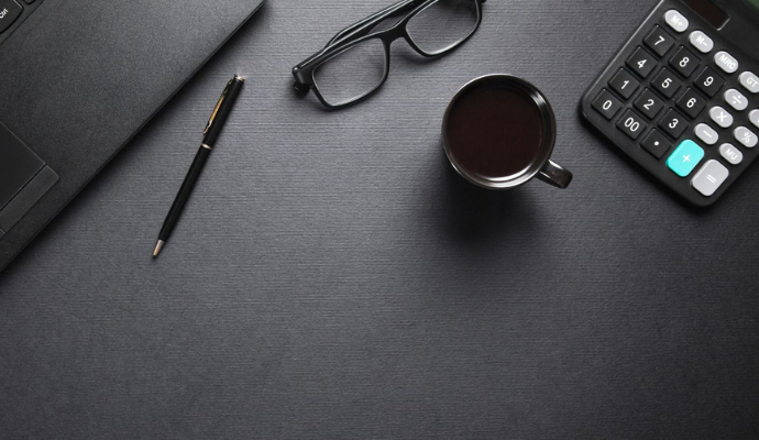 black-cup-black-eyeglasses-black-calculator-on-black-table-bdo